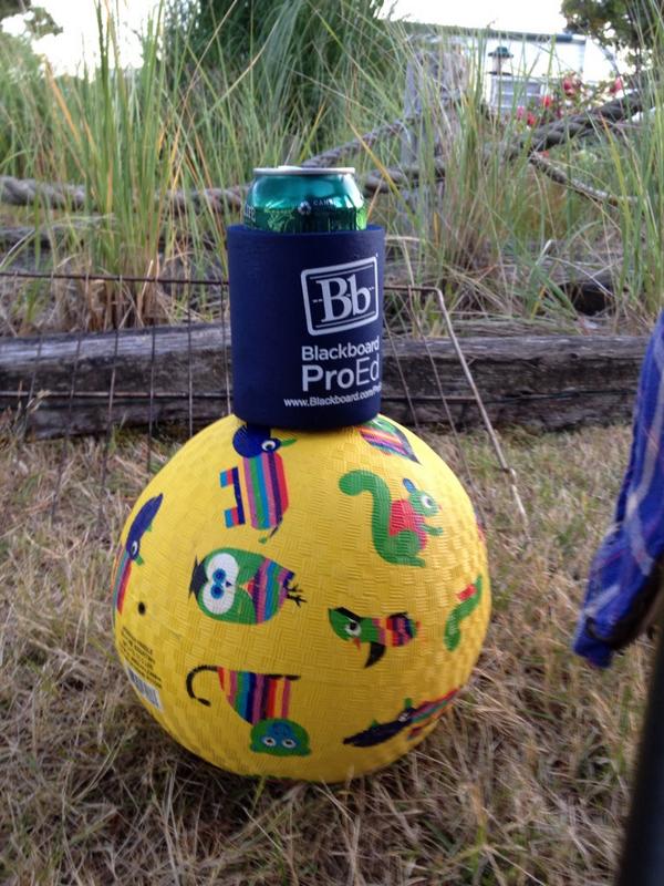 Tweet: A beer in a blackboard koozie on a ball at the bea…